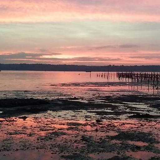 Photograph of a coastal area during sunset.
